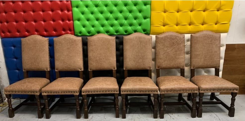 Hotel leather chairs after professional commercial upholstery restoration — clean and renewed appearance