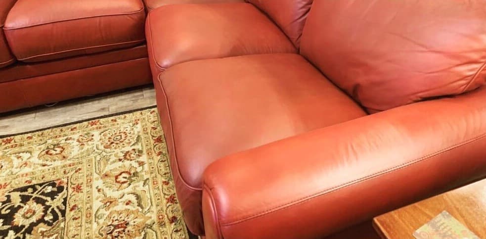 Leather sectional after professional color restoration — rich terra cotta finish in Bucks County PA