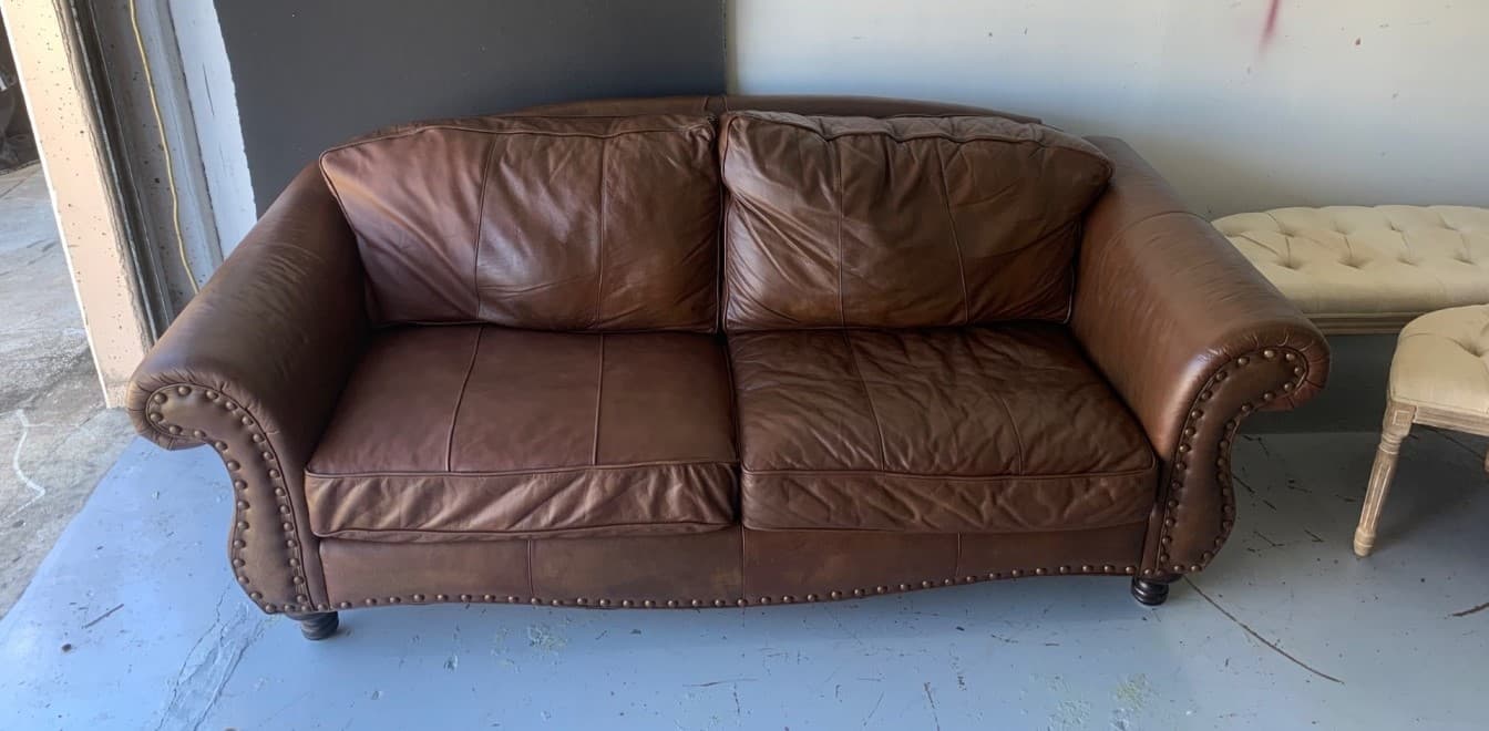 Brown leather sofa after full restoration in Doylestown PA