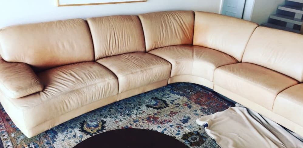 Faded beige leather sectional before color transformation in Princeton NJ