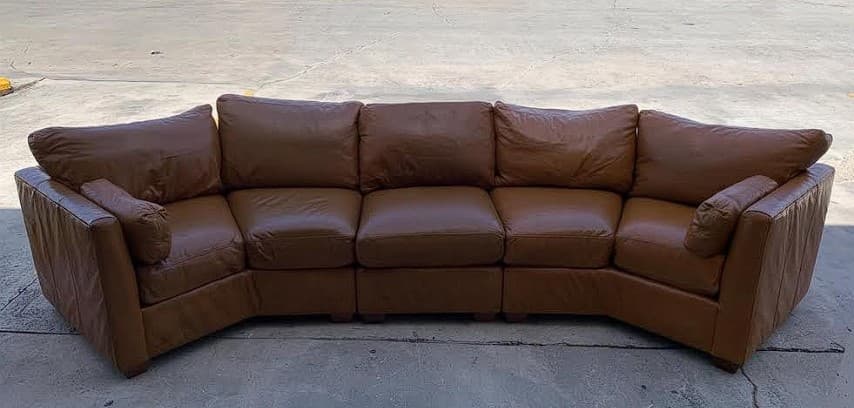 Large leather sectional after foam replacement and cushion refilling